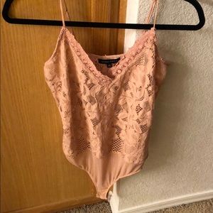 Blush lace body suit